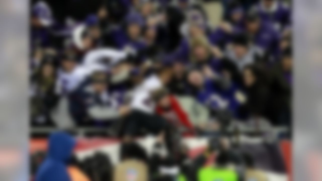Baltimore Ravens running back Ray Rice celebrates with fans in the stands after the AFC Championship Game victory over the New England Patriots. (Greg M. Cooper/US Presswire)