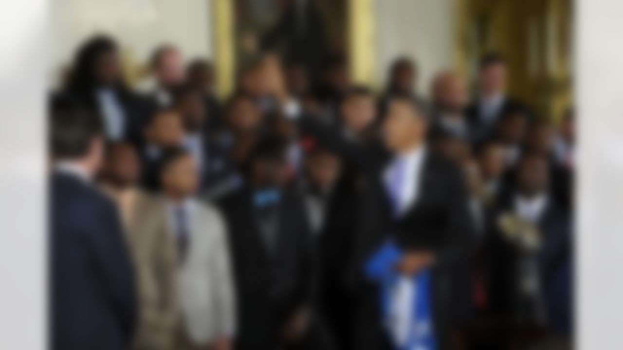 President Barack Obama waves to members of the NFL Super Bowl champion Seattle Seahawks football team after welcoming the team to the East Room of the White House in Washington, Wednesday, May 21, 2014. The Seahawks defeated the Denver Broncos in Super Bowl XLVIII. (Susan Walsh/Associated Press)