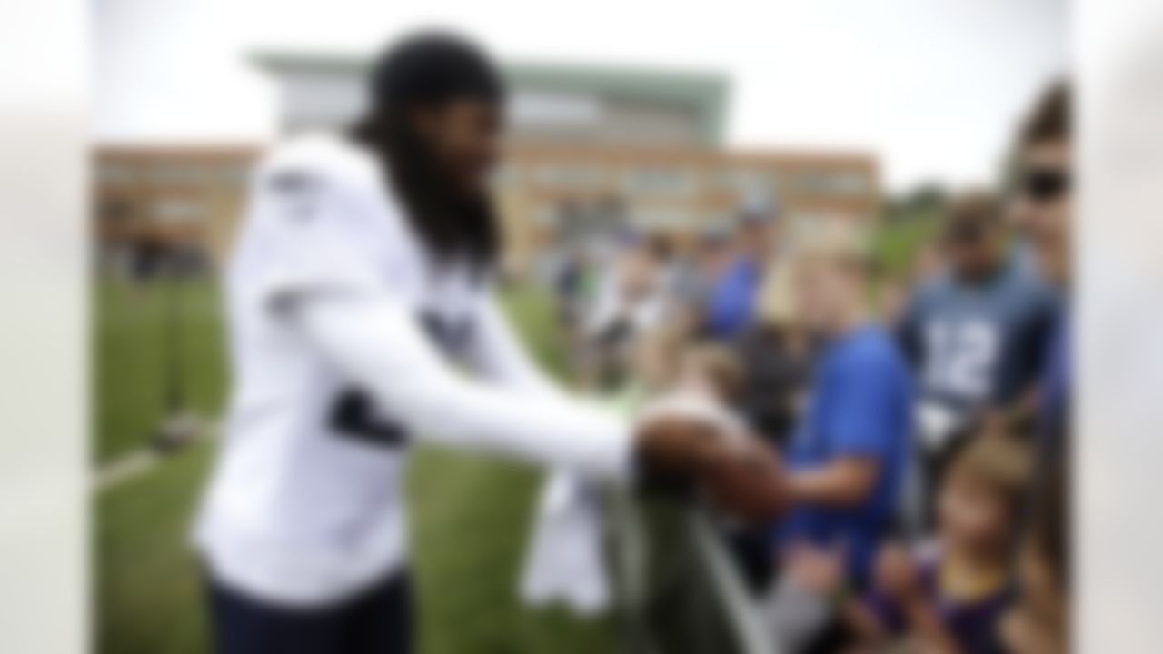 Seattle Seahawks cornerback Richard Sherman signs autographs during NFL football training camp, Monday, July 30, 2012, in Renton, Wash. (AP Photo/Ted S. Warren)