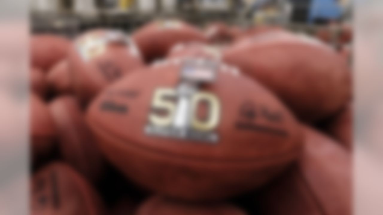 Official balls for the NFL Super Bowl 50 football game are seen in a bin prior to final inspection at the Wilson Sporting Goods Co. in Ada, Ohio, Tuesday, Jan. 26, 2016. The Denver Broncos will play the Carolina Panthers in the Super Bowl on Feb. 7 in Santa Clara, Calif.  (AP Photo/Rick Osentoski)