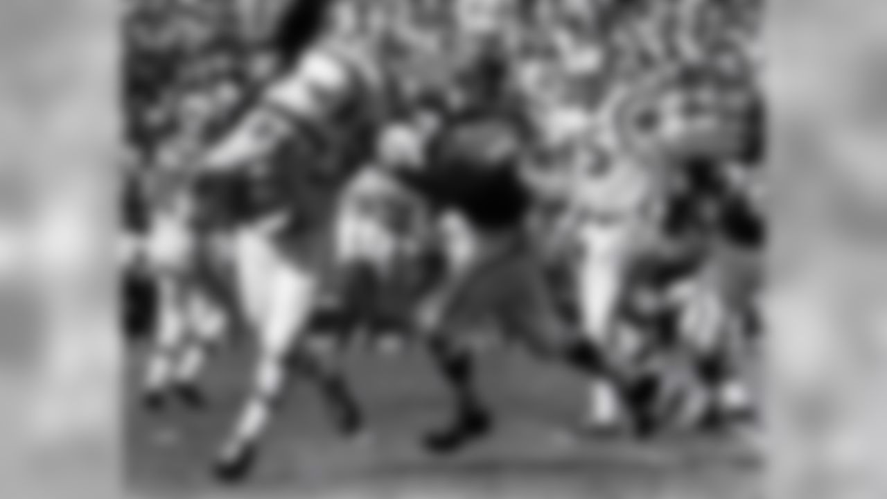 Hall of Fame linebacker Bobby Bell (78) of the Kansas City Chiefs tackles Bills fullback Carlton "Cookie" Gilchrist in a 35 to 26 loss to the Buffalo Bills on October 13, 1963 at Municipal Stadium in Kansas City, Missouri. (National Football League)