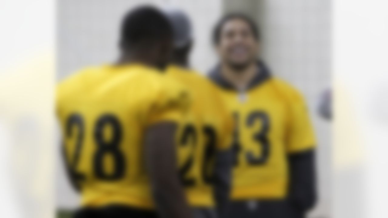 Pittsburgh Steelers safety Troy Polamalu (43) laughs as he talks with teammates during practice on Thursday, Feb. 3, 2011, in Fort Worth, Texas. The Steelers will play the Green Bay Packers in NFL football Super Bowl XLV Sunday, Feb. 6. (AP Photo/Mark Humphrey)