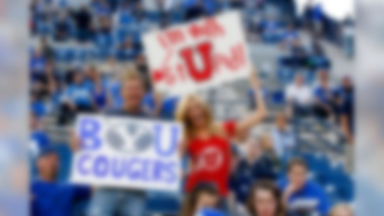Utah fan Mckinli Hatch has some fun at the expense of BYU fan Devan Hatch before the game at Lavell Edwards Stadium. (Chris Nicoll/USA TODAY Sports)