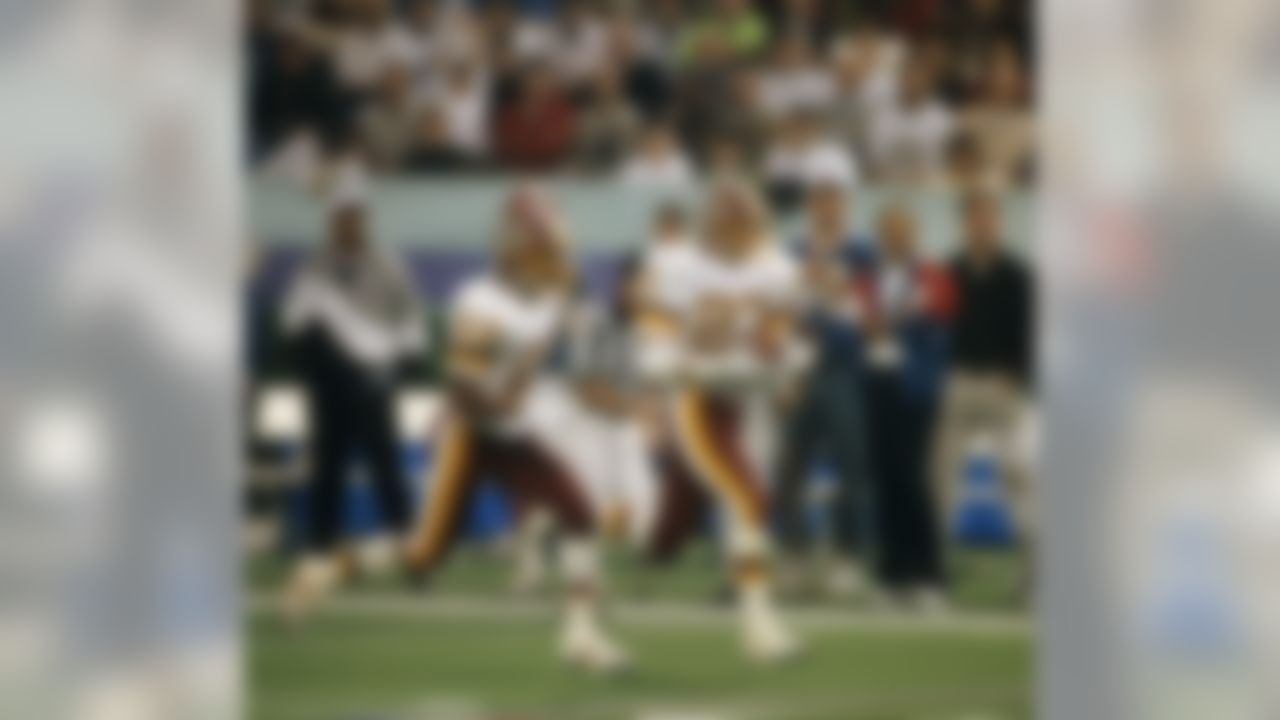 Washington Redskins safety Brad Edwards (27) runs with the football after intercepting a pass during the Redskins 37-24 victory over the Buffalo Bills in Super Bowl XXVI on January 26, 1992 at the Hubert H. Humphrey Metrodome in Minneapolis, Minnesota. (National Football League)