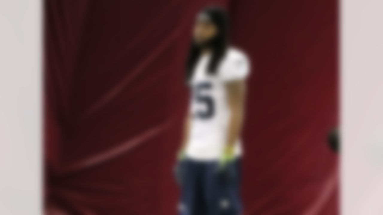 Seattle Seahawks' Richard Sherman stretches during a team practice for NFL Super Bowl XLIX football game, Friday, Jan. 30, 2015, in Tempe, Ariz. The Seahawks play the New England Patriots in Super Bowl XLIX on Sunday, Feb. 1, 2015. (AP Photo/Matt York)