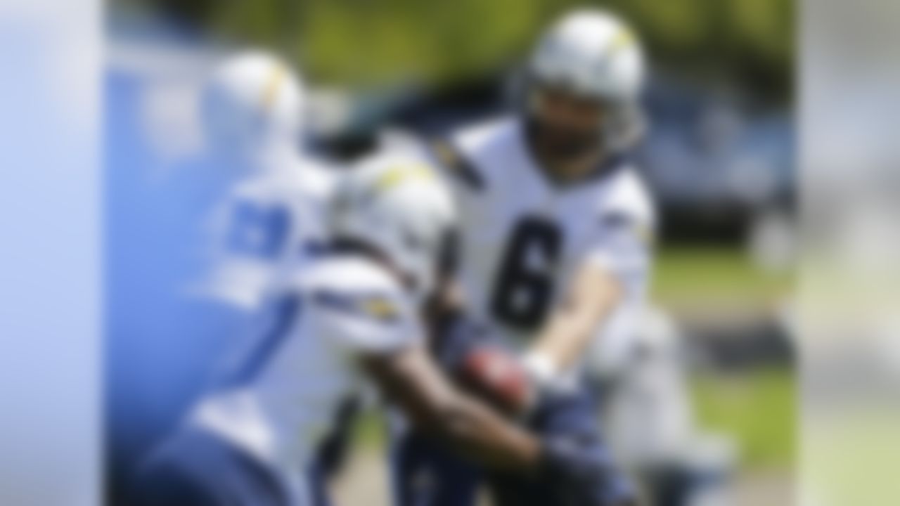 San Diego Chargers quarterback Charlie Whitehurst hands off during NFL football minicamp Thursday, April 18, 2013 in San Diego. (AP Photo/Lenny Ignelzi)