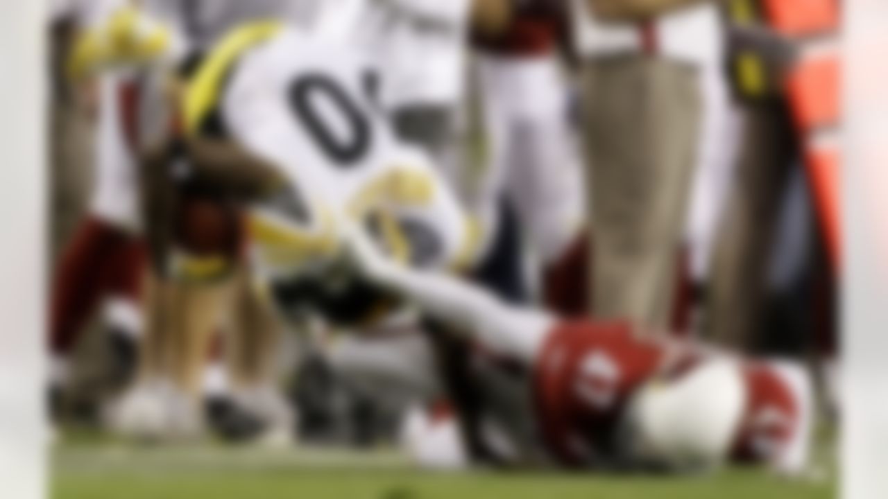 Pittsburgh Steelers wide receiver Santonio Holmes (10) is tackled by Arizona Cardinals safety Aaron Francisco (47) during the second quarter of the NFL Super Bowl XLIII football game, Sunday, Feb. 1, 2009, in Tampa, Fla. (AP Photo/Mark Humphrey)