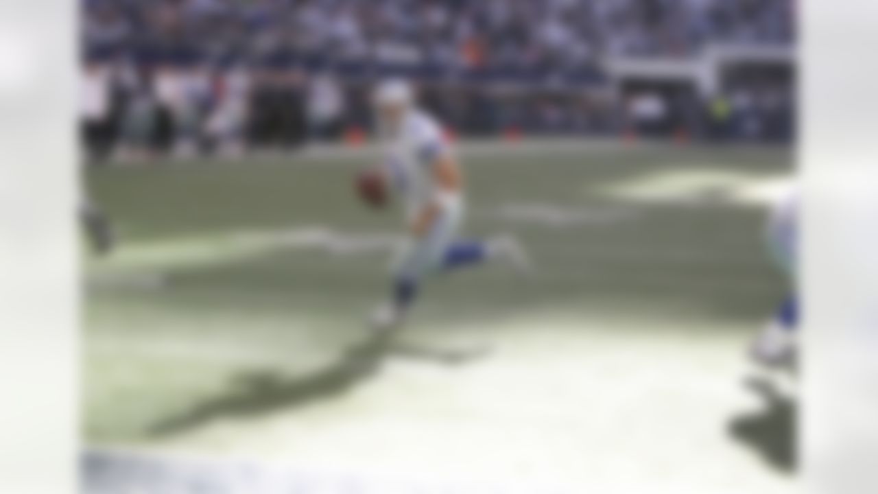 Dallas Cowboys quarterback Tony Romo (9) runs for a one-yard touchdown during an NFL football game against the New York Giants on Sunday, October 28, 2012, at Cowboys Stadium in Arlington, Texas. The Giants defeated the Cowboys, 29-24. (AP Photo/James D Smith)