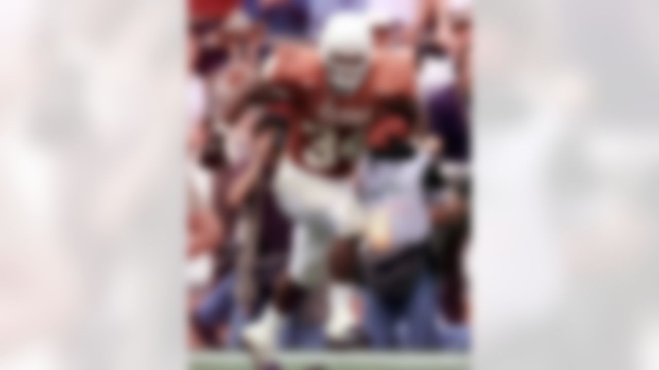 Texas running back Ricky Williams turns up field as he breaks the all-time NCAA rushing record with a 60-yard touchdown run against Texas A&M during the first quarter of an NCAA college football game in Austin, Texas, Friday, Nov. 27, 1998. (AP Photo/Eric Gay)