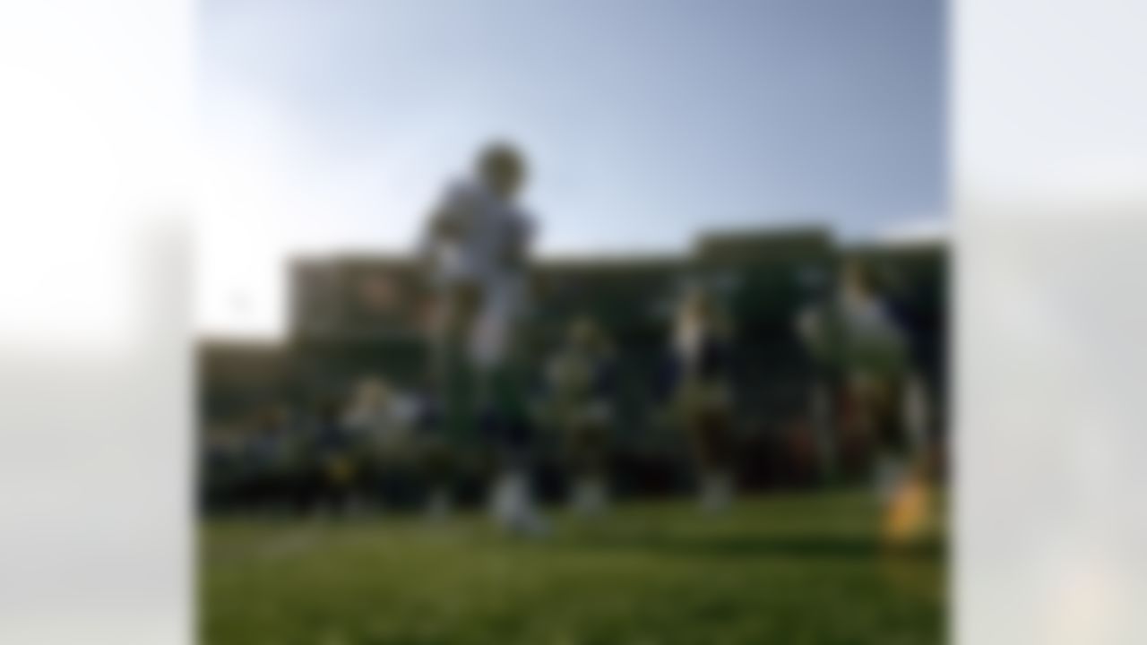 Dallas Cowboys Hall of Fame quarterback Troy Aikman (8) leads his team onto the field before Super Bowl XXVII, a 52-17 Cowboys victory over the Buffalo Bills on January 31, 1993, at the Rose Bowl in Pasadena, California. (National Football League)