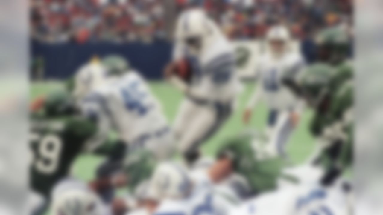 Indianapolis Colts running back Eric Dickerson (29) leaps over a pile of players at the goal line for his second touchdown of the third quarter. Dickerson ended the day with 117 yards and two touchdowns to help lead the Colts to a 29-21 win over the New York Jets at Giants Stadium on Sunday, Dec. 16, 1990 in East Rutherford. (AP Photo/Bill Kostroun)