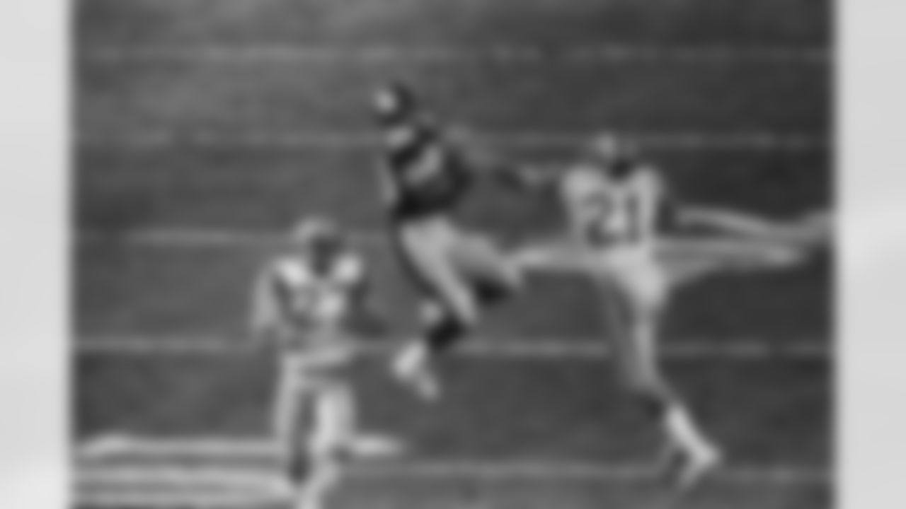 Los Angeles Rams defenders Nolan Cromwell (21) and Pat Thomas (27) arrive too late to prevent Pittsburgh Steelers receiver Lynn Swann from making one of his patented leaping pass receptions. Action came on Sunday during Super Bowl XIV in Rose Bowl Stadium on Jan. 21, 1980 in Pasadena, Calif. Steelers; aided by a Swann touchdown reception, beat Rams, 31-19. (Associated Press)