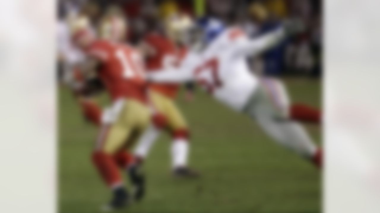 San Francisco 49ers' Kyle Williams (10) fumbles as he is hit by New York Giants' Jacquian Williams (57) during overtime of the NFC Championship NFL football game Sunday, Jan. 22, 2012, in San Francisco. The Giants won 20-17 to advance to Super Bowl XLVI. (AP Photo/Paul Sakuma)