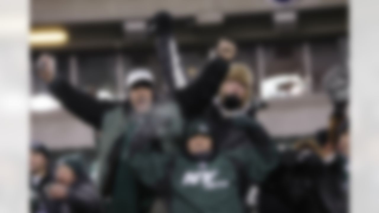 New York Jets fans celebrate following the AFC Wild Card Playoff game against the Cincinnati Bengals at Paul Brown Stadium in Cincinnati, Ohio on January 9, 2010. The Jets won 24-14. (Joe Robbins / NFL.com)