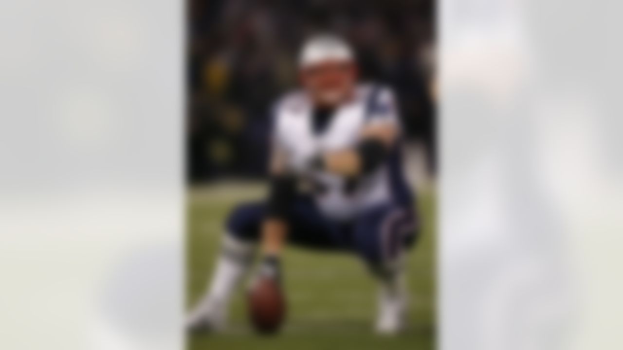 BALTIMORE - DECEMBER 3: Center Dan Koppen #67 of the New England Patriots points out a defensive gap against the Baltimore Ravens at M&T Bank Stadium on December 3, 2007 in Baltimore, Maryland. The Patriots won the game 27-24. (Photo by Thomas E. Witte/Getty Images)