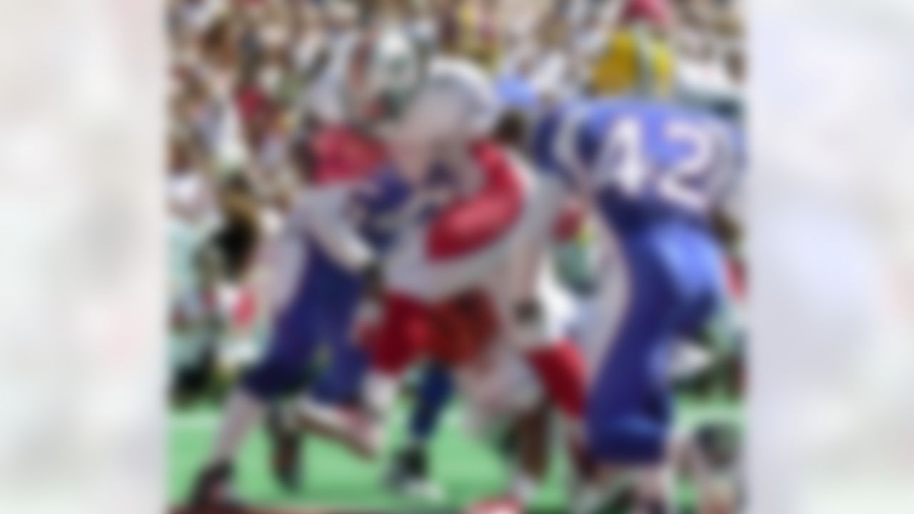 Ricky Williams of the Miami Dolphins bowls his way through the NFC for the first touchdown of the game in the first quarter of the Pro Bowl at Aloha Stadium in Honolulu Sunday, Feb. 2, 2003. (AP Photo/Reed Saxon)