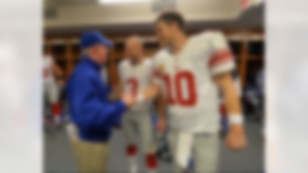 New York Giants head coach Tom Coughlin celebrates a victory with kicker Josh Brown (3) and quarterback Eli Manning (10) after a week 16 football game against the Detroit Lions on December 22, 2013 in Detroit, Michigan. (AP Photo/Evan Pinkus)