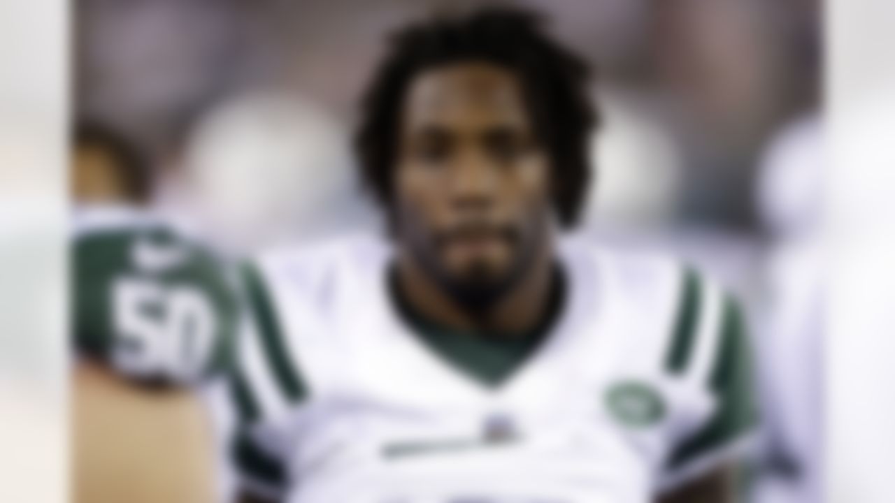 New York Jets cornerback Antonio Cromartie looks on from the bench during the second half of an NFL preseason football game against the Jacksonville Jaguars, Saturday, Aug. 17, 2013, in East Rutherford, N.J. (AP Photo/Seth Wenig)