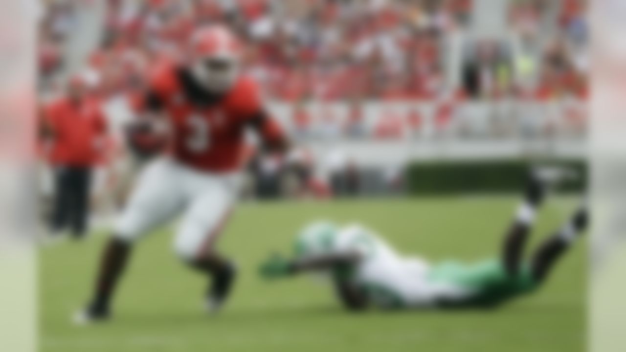 Georgia running back Todd Gurley (3) gets away from North Texas defensive back James Jones (13) as he runs for a touchdown in the first half of an NCAA college football game Saturday, Sept. 21, 2013 in Athens, Ga. (AP Photo/John Bazemore)