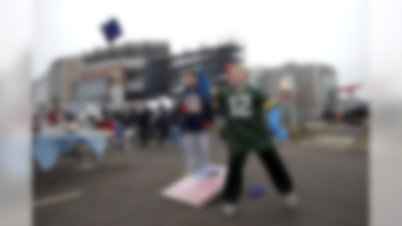 Connor Kiely tosses a beanbag while tailgating with friends in the parking lot of Gillette Stadium before the AFC championship NFL football game between the New England Patriots and the Pittsburgh Steelers, Sunday, Jan. 22, 2017, in Foxborough, Mass. (AP Photo/Steven Senne)