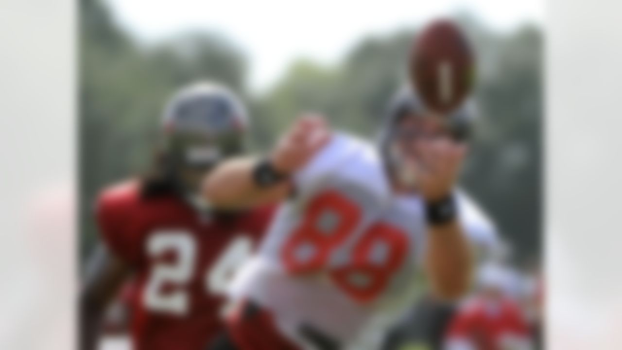 Tampa Bay Buccaneers tight end Luke Stocker, right, hauls in a pass in front of safety Mark Barron during NFL football training camp, Friday, July 27, 2012, in Tampa, Fla. (AP Photo/Brian Blanco)