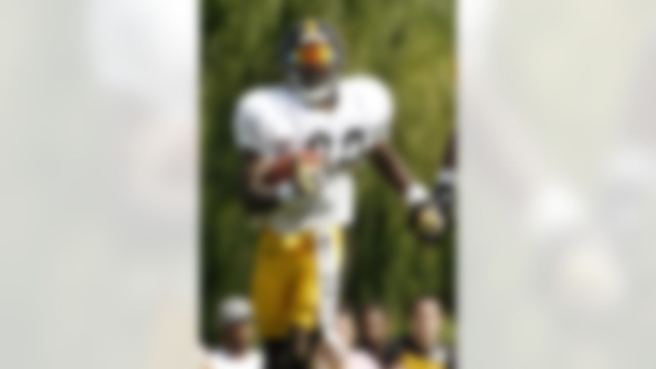 Pittsburgh Steelers running back Chris Rainey (22) runs the ball with a towel with "Rainman" written on it during practice at the NFL football training camp in Latrobe, Pa., Sunday, July 29, 2012. (AP Photo/Keith Srakocic)