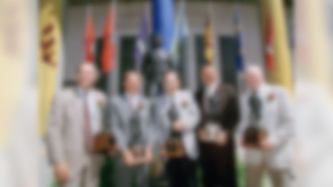 Former football greats, from left to right; Gary Beban, from the UCLA Bruins, Pat Haden, Los Angeles Rams quarterback, Al Krueger from the University of Southern California, Chicago Bears' Dick Butkus, and Harry Gilmer from the University of Alabama, stand with awards outside of the Rose Bowl as they were all inducted into the Rose Bowl Hall of Fame, Aug. 10, 1995 in Pasadena, Calif. All five have played in the college Rose Bowl. (Nick Ut/Associated Press)