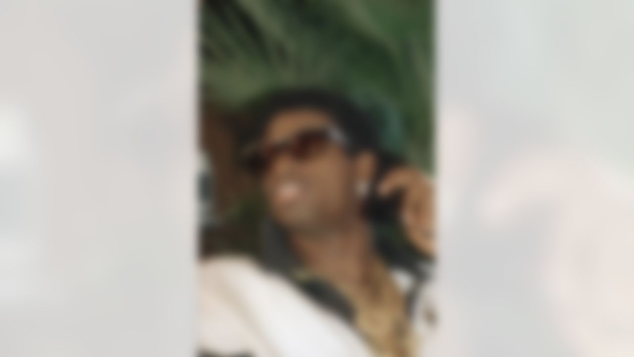 Florida State's Deion Sanders listens on the phone as he waits for the announcement April 23, 1989 of his selection in the upcoming NFL draft at the Winnetka, Illinois home of his agent. Sanders was selected by the Atlanta Falcons. (AP Photo)