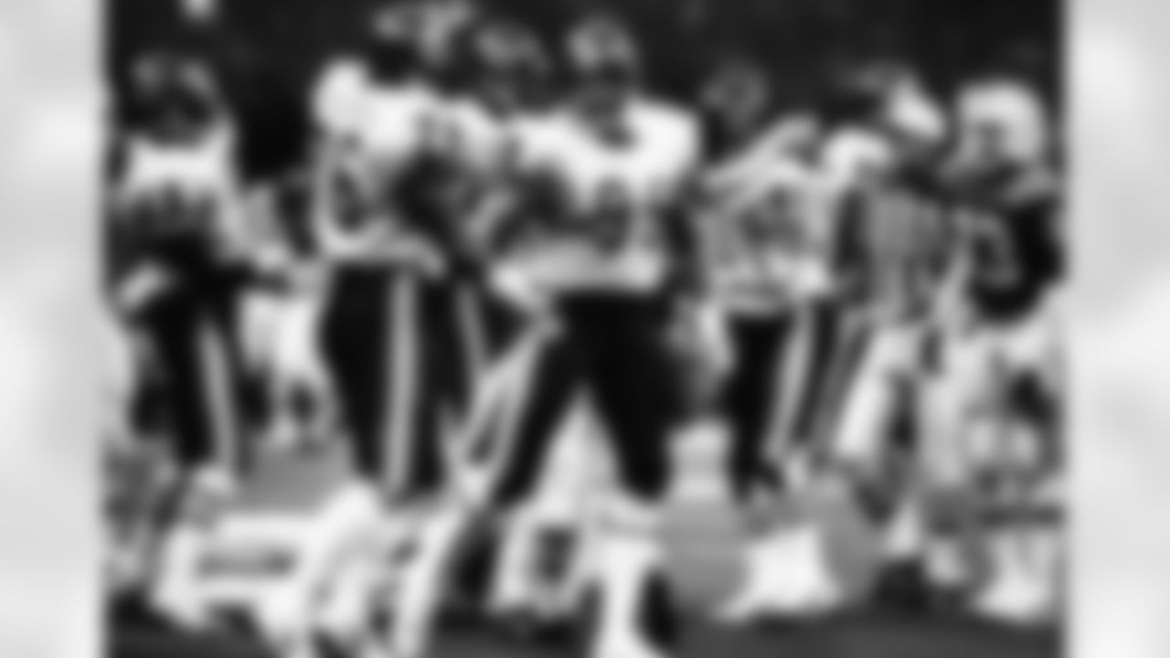 Chicago Bears Hall of Fame defensive end Dan Hampton (99) celebrates with defensive tackle Steve McMichael (76), as Hall of Fame linebacker Mike Singletary (50) celebrates with Hall of Fame defensive end Richard Dent (95) after a sack of New England Patriots quarterback Tony Eason (14) during Super Bowl XX at the Superdome in New Orleans, January 26, 1986. (National Football League)