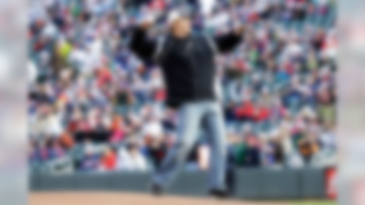 Former Minnesota Vikings and Baltimore Ravens NFL football Pro Bowl center Matt Birk acknowledges the crowd before throwing a ceremonial first pitch before the Minnesota Twins and Baltimore Orioles baseball game, Saturday, May 11, 2013 in Minneapolis. (AP Photo/Jim Mone)