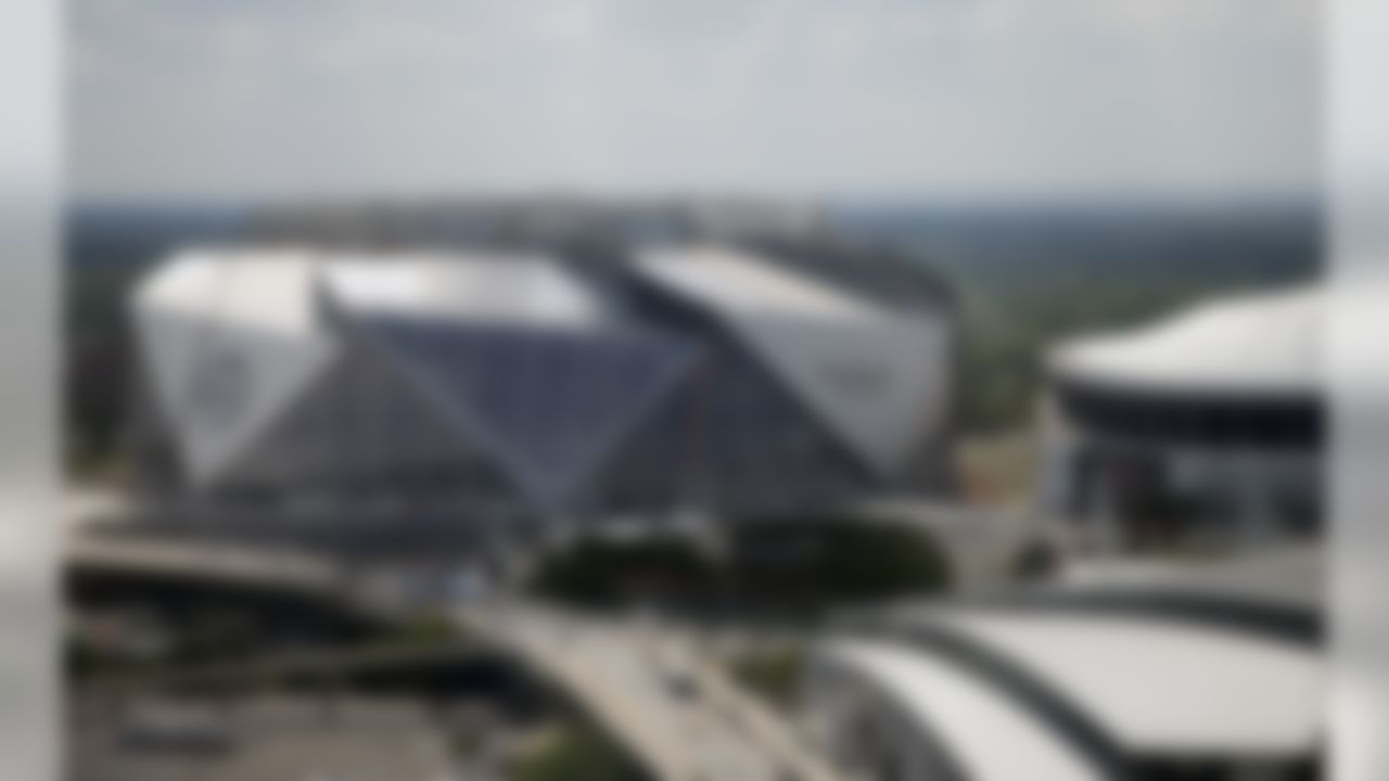 Rapper T.I. looks out from a suite during a tour of Mercedes-Benz Stadium,  the new stadium for the Atlanta Falcons NFL football team under  construction in Atlanta, Tuesday, April 25, 2017. (AP