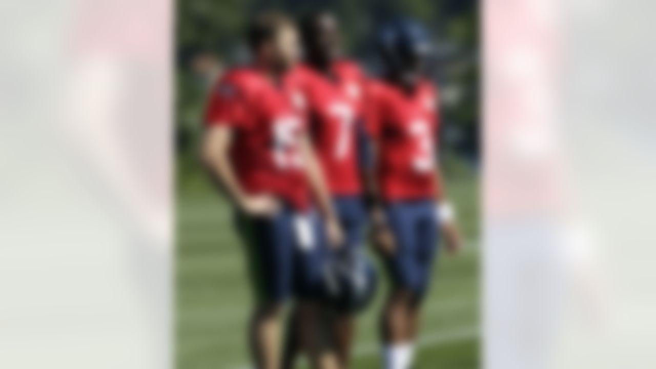 Seattle Seahawks quarterbacks Matt Flynn (15), Tavaris Jackson (7) and Russell Wilson (3) attend NFL football training camp drills in Renton, Wash., Friday, Aug. 3, 2012. (AP Photo/Ted S. Warren)