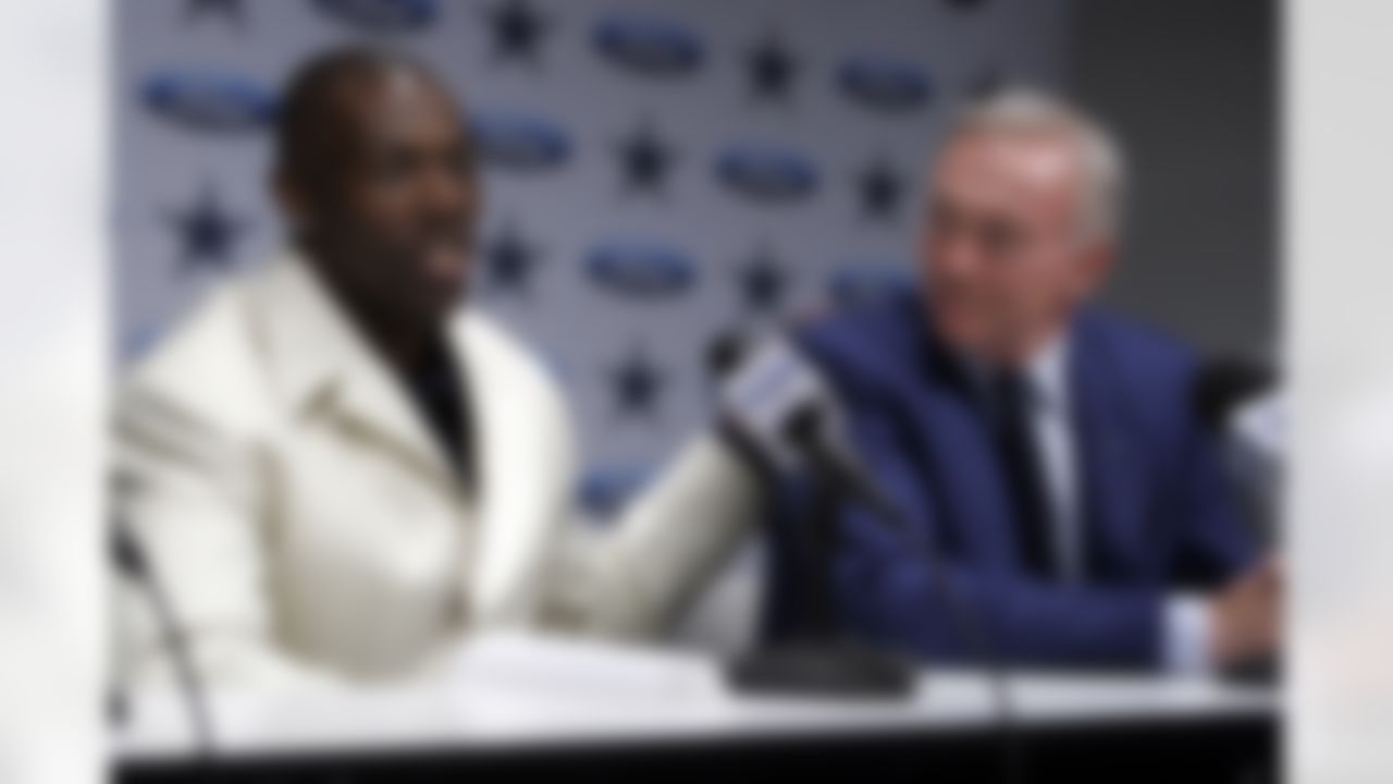 Terrell Owens, left, speaks at a news conference in Irving, Texas, Saturday, March 18, 2006, in Irving, Texas, where Dallas Cowboys' owner Jerry Jones, right, introduced him to the media. (AP Photo/Ron Heflin)
