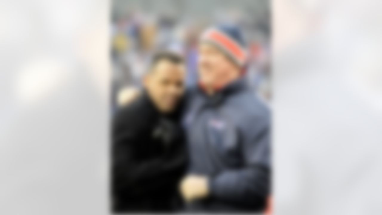 Buffalo Bills alumni Andre Reed, left, greets Jim Kelly during halftime of the Miami Dolphins and Buffalo Bills NFL football game in Orchard Park, N.Y., Sunday, Dec. 18, 2011. (AP Photo/Gary Wiepert)
