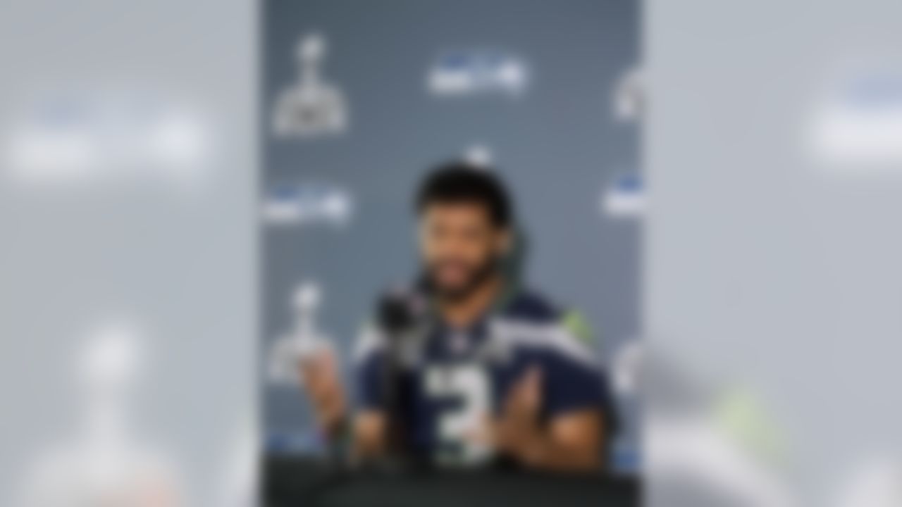 Seattle Seahawks' Russell Wilson answers a question during an interview for NFL Super Bowl XLIX football game, Thursday, Jan. 29, 2015, in Phoenix. The Seahawks play the New England Patriots in Super Bowl XLIX on Sunday, Feb. 1, 2015. (AP Photo/Matt York)