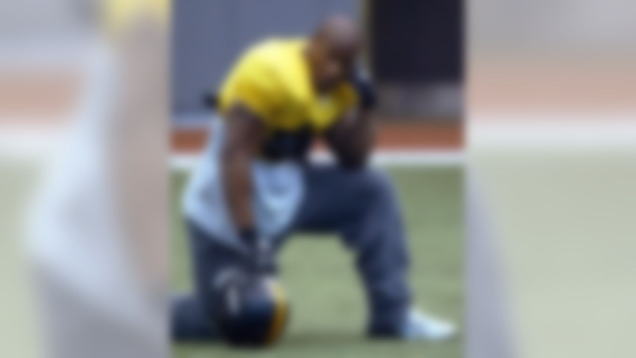 James Harrison, a linebacker cut three times previously by NFL teams, twice by the Steelers, listens to coaches during practice at the team facility in Pittsburgh on Thursday, Dec. 16, 2004. Harrison was expected to start the following Saturday against the Giants and Dec. 26 against the Ravens for the injured Clark Haggans.