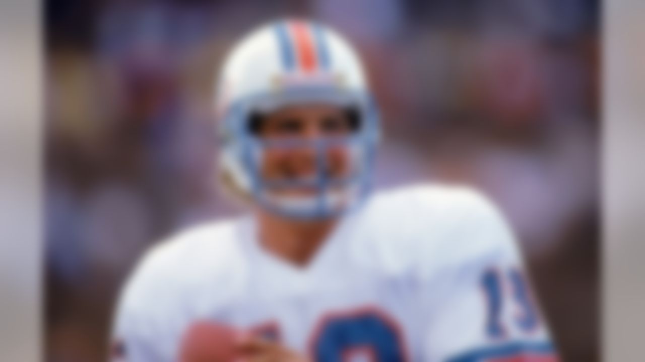 MIAMI - 1986: Quarterback Dan Marino #13 of the Miami Dolphins smiles as he holds the ball during a game against the Atlanta Falcons in 1986 at Pro Player Stadium in Miami, Florida. Falcons won 20-14. (Photo by Bob Martin/Getty Images)