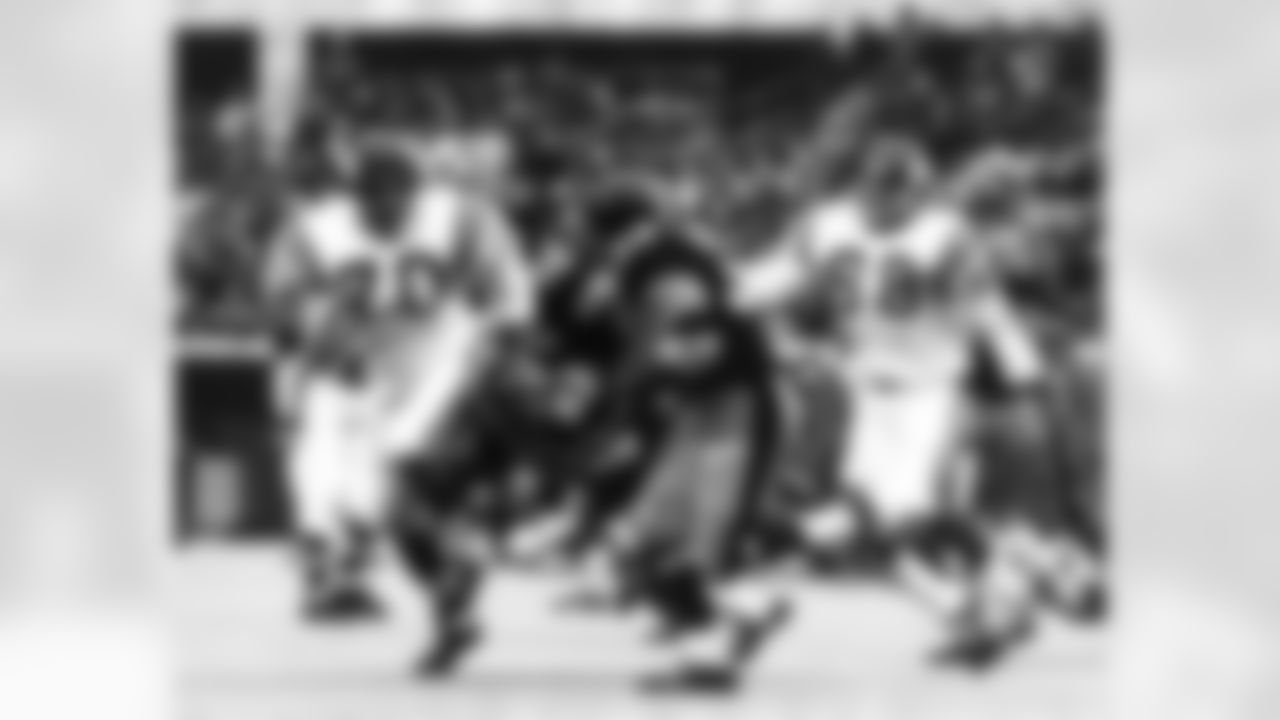 Pittsburgh Steelers running back John "Frenchy" Fuqua (33) carries the football and is pursued by Vikings defensive end Jim Marshall (70) and Hall of Fame defensive tackle Alan Page (88) during the Steelers 23-10 victory over the Minnesota Vikings. (National Football League)