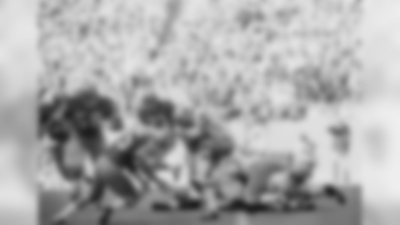 Cliff Harris (43) Dallas Cowboys kickoff return specialist, romps past several fallen players into the arms of Larry Schreiber (35) San Francisco 49ers back on the opening play of the NFC Championship game, Jan. 2, 1972, Dallas, Tex. (Associated Press)