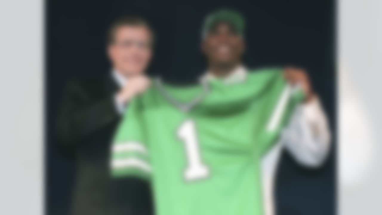 Keyshawn Johnson, a wide reciever from the University of Southern California, holds a Jets football jersey with NFL Commissioner Paul Tagliabue, left, after being taken by the New York Jets as the first pick in the NFL draft in New York Saturday, April 20, 1996.