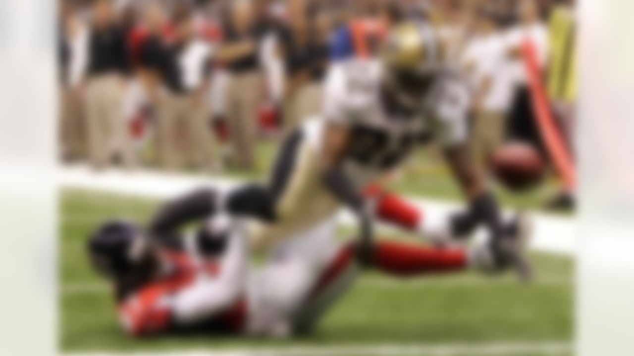 New Orleans cornerback Fred Thomas (22) breaks up a touchdown pass intended for Atlanta receiver Ashley Lelie (87) during the first half Monday, September 25, 2006, at the Superdome in New Orleans, Louisiana. Photo by Getty Images.