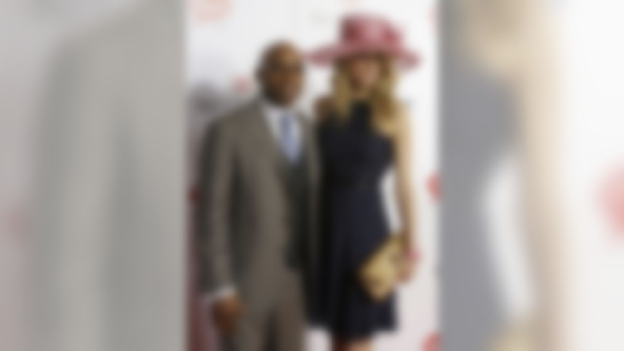 Former NFL player Tiki Barber arrives with Traci Lynn Johnson to attend the 139th Kentucky Derby at Churchill Downs Saturday, May 4, 2013, in Louisville, Ky. (AP Photo/Darron Cummings)
