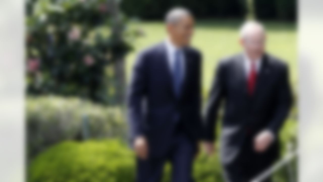 President Barack Obama walks with New York football Giants head coach Tom Coughlin to the South Lawn at the White House in Washington, Friday, June 8, 2012, for a ceremony where the president honored the Super Bowl XLVI champions New York Giants. (AP Photo/Charles Dharapak)