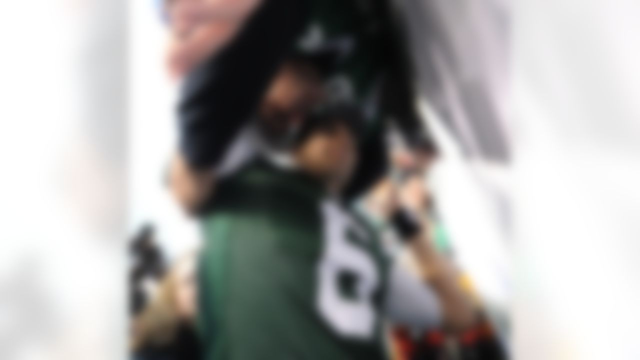 New York Jets quaterback Mark Sanchez (6) shares a moment with fireman Ed after beating the Buffalo Bills in a week 17 NFL football game at the New Meadowlands Stadium in East Rutherford, New Jersey on Sunday January 2, 2011 (AP Photo/Evan Pinkus)