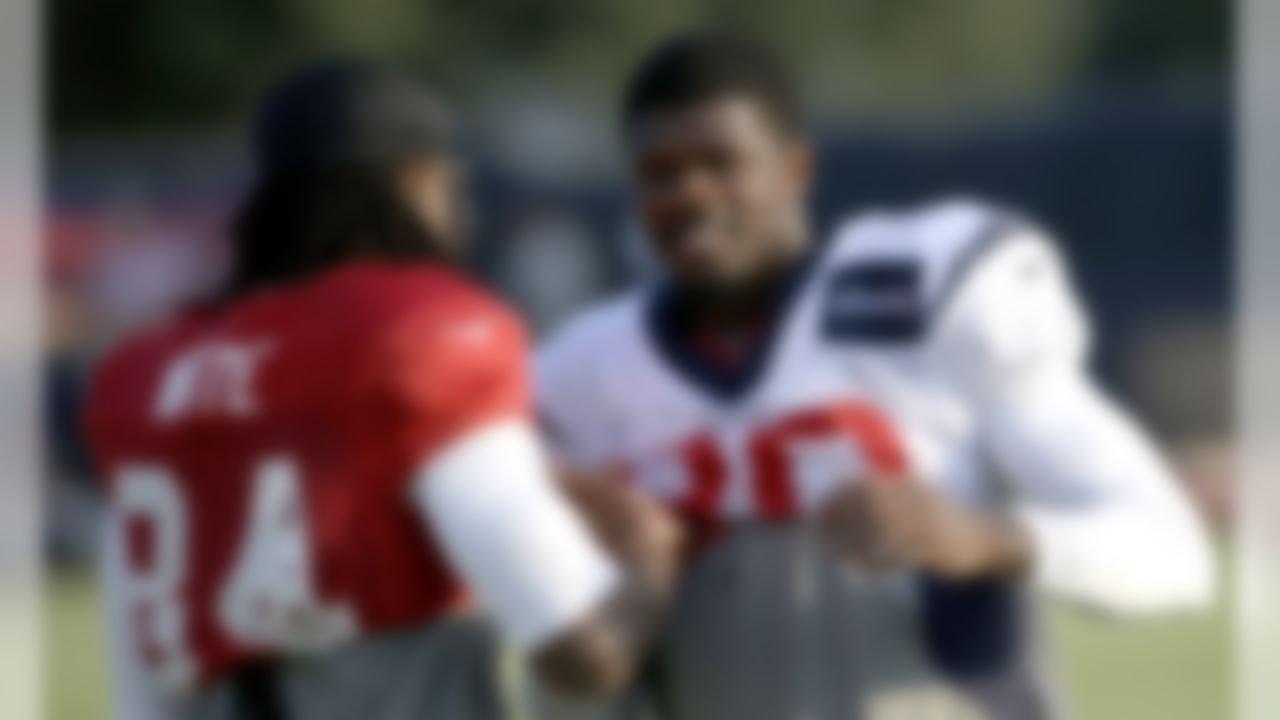 Houston Texans wide receiver Andre Johnson, right, talks with Atlanta Falcons wide receiver Roddy White (84) during an NFL football training camp practice Wednesday, Aug. 13, 2014, in Houston.The Falcons are practicing with the Texans this week before their preseason game Saturday. (AP Photo/David J. Phillip)