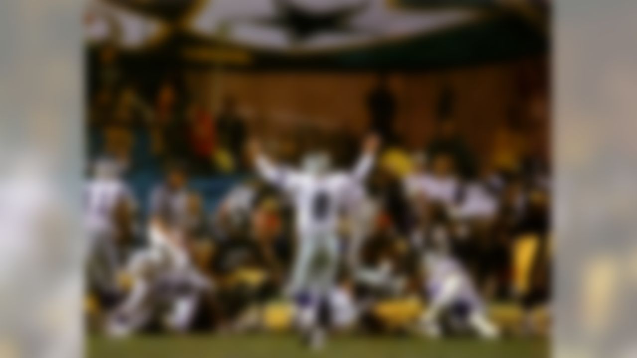 Dallas Cowboys quarterback Troy Aikman (8) celebrates his teammate Emmitt Smith's touchdown against the Pittsburgh Steelers in the third quarter during Super Bowl XXX at Sun Devil Stadium in Tempe, AZ on January 28, 1996. (AP Photo/Michael S. Green)