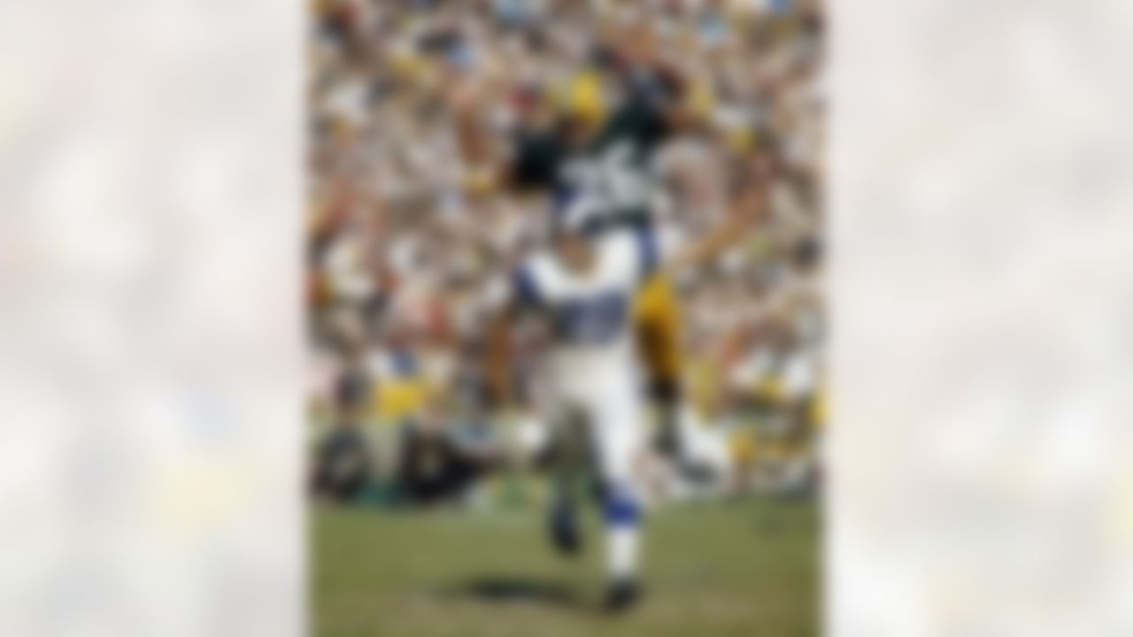 Green Bay Packers Hall of Fame cornerback Herb Adderley (26) dives to break up a pass intended for Los Angeles Rams Hall of Fame wide receiver Tommy McDonald (29) during a 27-23 Packers victory on December 18, 1966, at the Los Angeles Memorial Coliseum in Los Angeles, California. (James Flores/NFL)