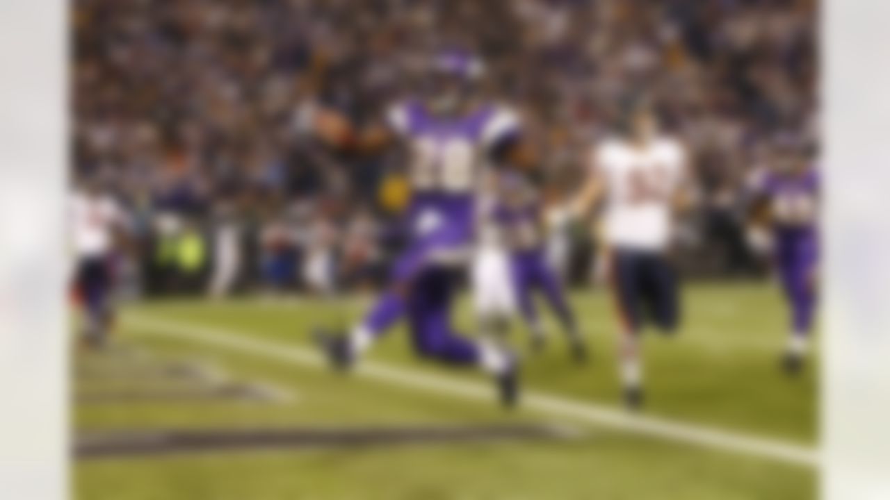 Adrian Peterson #28 of the Minnesota VIkings leaps into the end zone as he scores a touchdown during action against the Chicago Bears on December 17, 2007 in Minneapolis, Minnesota. The Vikings defeated the Bears 20-13. (AP Photo/G. Newman Lowrance)