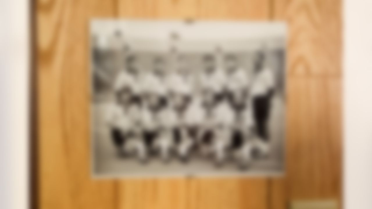 A photo of Jack Harbaugh (top row, third from right), assistant coach at the University of Michigan, is on display at his home in Mequon, WI. (Todd Rosenberg/NFL)
