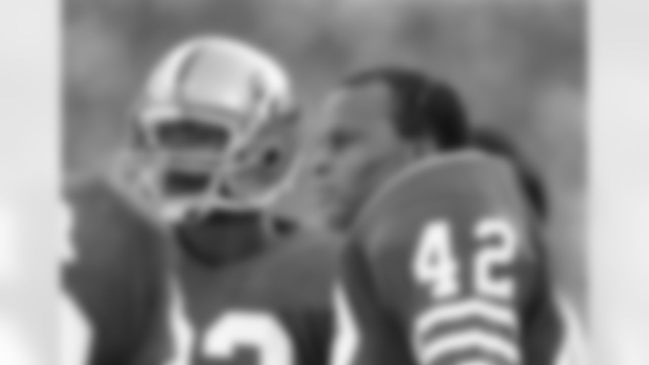 San Francisco 49ers defensive back Ronnie Lott (42) takes a breather during an NFL football game against the Minnesota Vikings on Sunday, Jan. 1, 1989, in San Francisco. The 49ers won the game, 34-9. (AP Photo/Greg Trott)